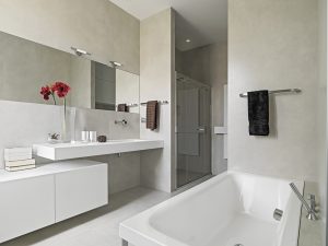 panoramic view of a modern bathroom with washbasin and bathtub